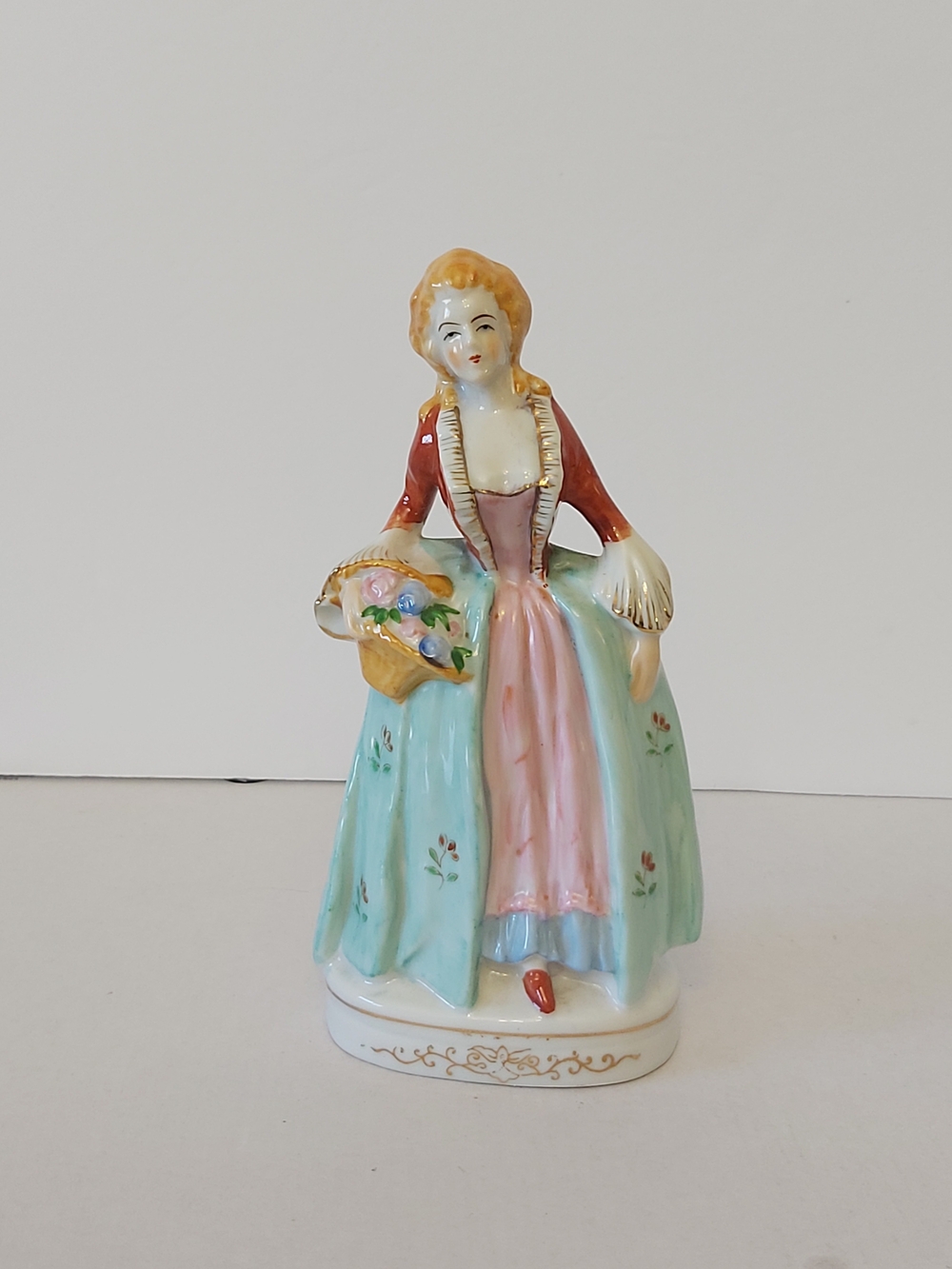 Porcelain Figurine of Woman in Pastel Dress - Blue & Pink